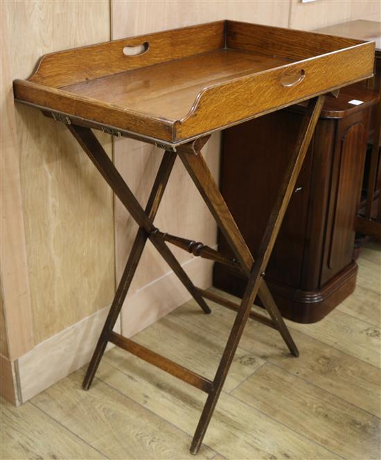A Victorian oak butlers tray, on turned stand W.76cm
